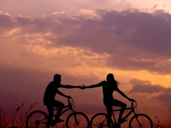 A Couple Taking A Bike Ride Just Before Sunset While On A Romantic Getaway At Twin Pine Manor In Lancaster County, Pa