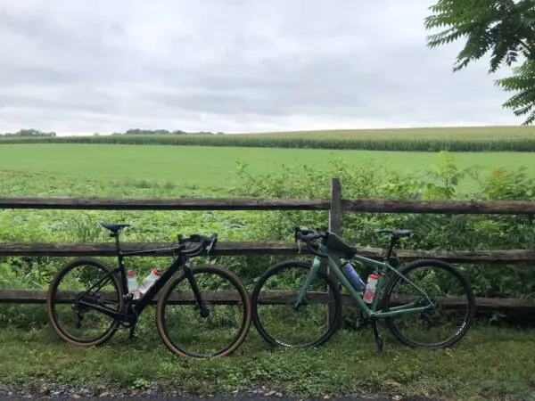Two Bikes Next To An Amish Farm Field In Lancaster, Pa