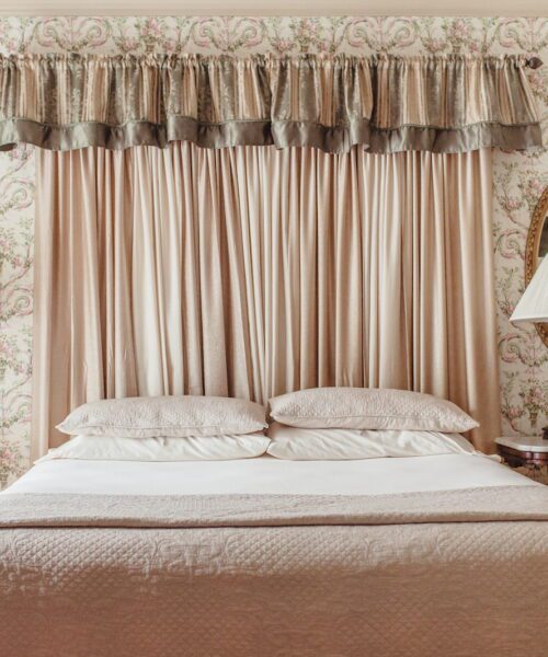A White Comfy Room For Two At Twin Pine Manor.