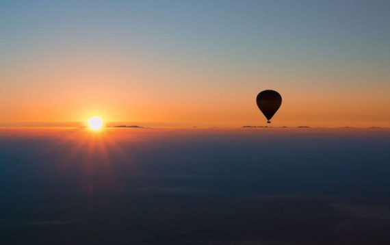 A hot air balloon rising above the morning sky in Lancaster County, PA.